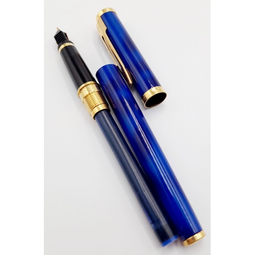 570 - A Watermans Decorative Blue Lacquer Pen with 18K Gold Nib. 13cm length.