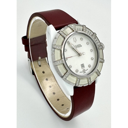 577 - A Bulova Accutron Diamond Ladies Watch. Red leather strap. Ceramic and steel case - 36mm. Diamond be... 