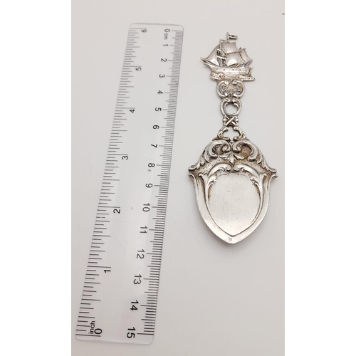 1699 - A SILVER FOB SPOON WITH GALLEON HANDLE .     20gms