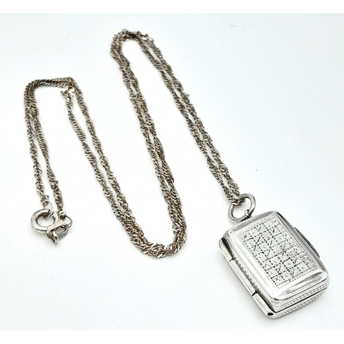 1700 - AN ANTIQUE SILVER VINIGARETTE ON A 50cms SILVER CHAIN . 7.2gms