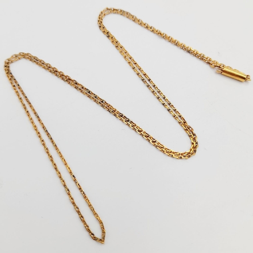 727 - A VINTAGE 14K GOLD NECK CHAIN .    2.8gms   52cms