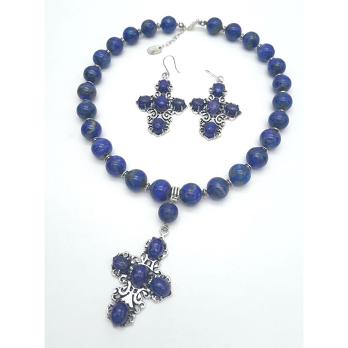 1051 - A sterling silver and genuine lapis lazuli necklace and earrings set with large cross shaped pendant... 