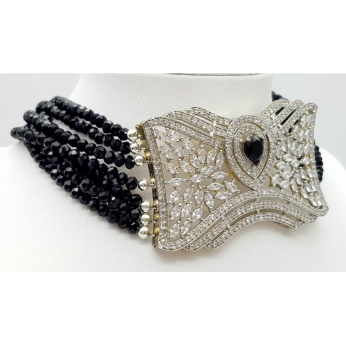 1044 - A very glamorous choker necklace and earrings set, gem-studded with cubic zirconia and black onyx, o... 