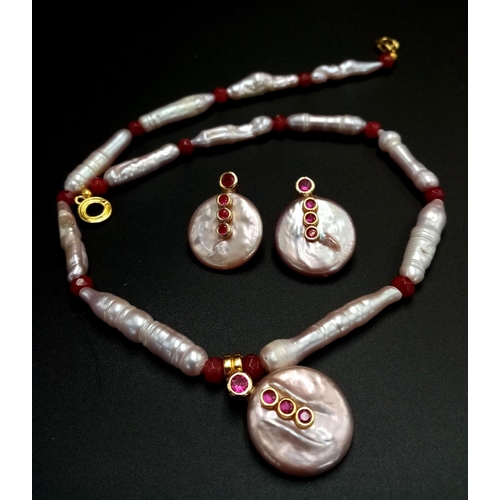 851 - A fine, large elongate pearls with round flat pearl accents and adorned with rubies necklace and ear... 