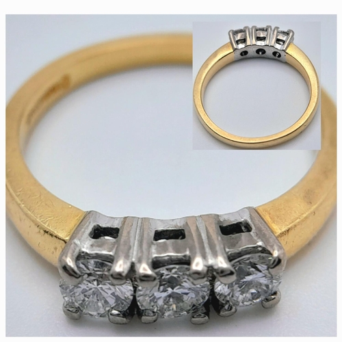 109 - AN 18K YELLOW GOLD DIAMOND 3 STONE RING - 0.50CT. 3.8G. SIZE L. REF: SPAS 5001