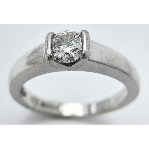 137 - AN 18K WHITE GOLD DIAMOND SOLITAIRE RING - 0.33CT ROUND BRILLIANT CUT. 3.8G. SIZE I. REF: A/S 1086