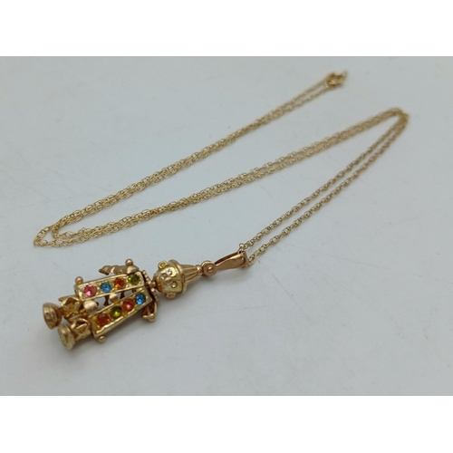 147 - 9 carat GOLD CLOWN PENDANT, Having coloured jewel detail with movable parts. Fully hallmarked and mo... 