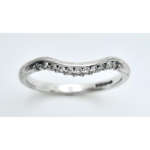 165 - A 18K WHITE GOLD DIAMOND SET CURVED BAND RING. 2.8G IN WEIGHT. SIZE N 1/2. Ref: SC 5035.