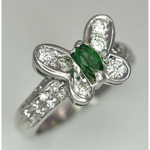 186 - A 18K WHITE GOLD DIAMOND & EMERALD BUTTERFLY RING. 4.7G IN WEIGHT. SIZE K. Ref: 8458.