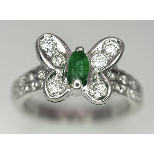 186 - A 18K WHITE GOLD DIAMOND & EMERALD BUTTERFLY RING. 4.7G IN WEIGHT. SIZE K. Ref: 8458.