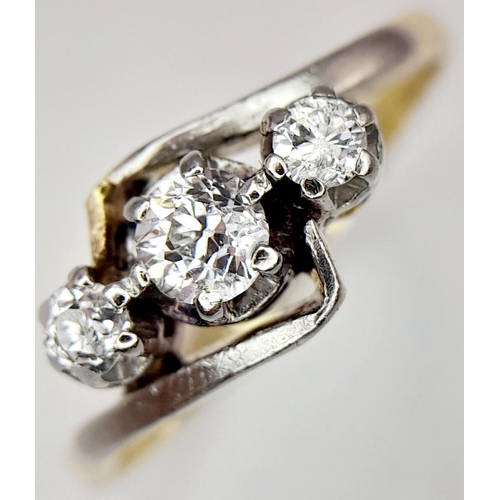 193 - A 18K YELLOW GOLD & PLATINUM VINTAGE OLD CUT DIAMOND 3 STONE RING. 0.25CT. 2.96G IN WEIGHT. SIZE L. ... 