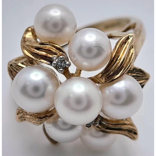 200 - A 9K YELLOW GOLD PEARL & DIAMOND CLUSTER RING - 4.6G. SIZE M.