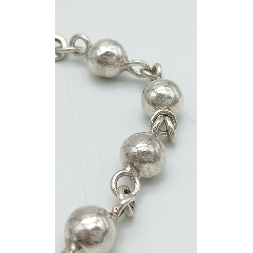 217 - SOLID SILVER BOULES BRACELET. Handmade with ‘S’ clasp fastening. 20 cm.