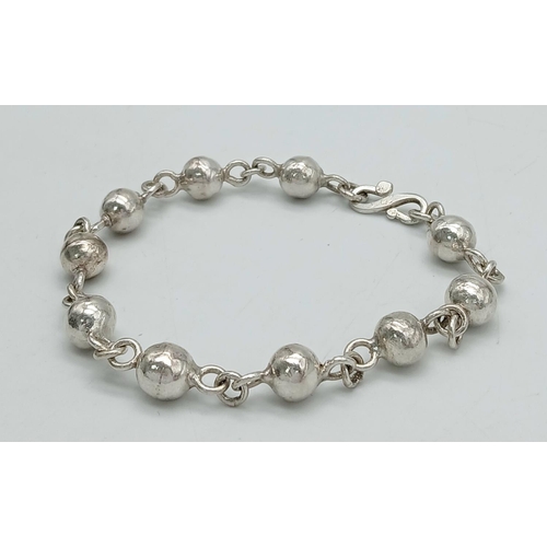 217 - SOLID SILVER BOULES BRACELET. Handmade with ‘S’ clasp fastening. 20 cm.