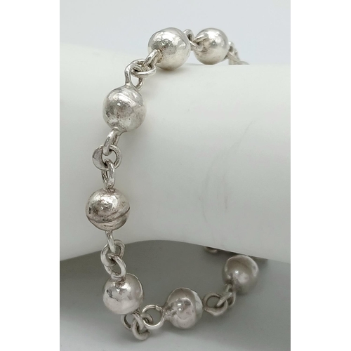 217 - SOLID SILVER BOULES BRACELET. Handmade with ‘S’ clasp fastening. 20 cm.