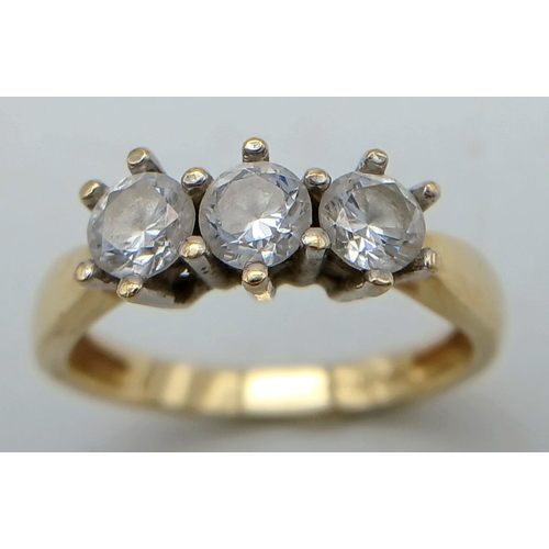 231 - Classic 14 carat YELLOW GOLD TRILOGY RING. Having 3 x Sparkling round cut ZIRCONIA gemstones set to ... 