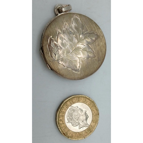 238 - Large vintage SILVER LOCKET. Circular form with beautiful engraved design to front. Opens and closes... 