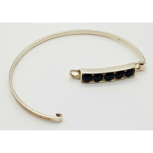 245 - Genuine Paul Kennedy SILVER and BLACK ONYX BANGLE. Having five cushion cut BLACK ONYX mounted to top... 