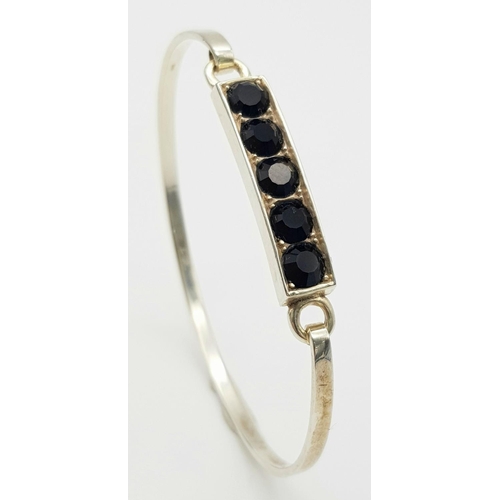 245 - Genuine Paul Kennedy SILVER and BLACK ONYX BANGLE. Having five cushion cut BLACK ONYX mounted to top... 