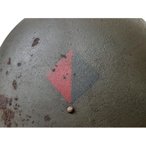 248 - WW2 British 44 Pattern “Turtle” D-Day Helmet and liner, with insignia of the Royal Artillery.