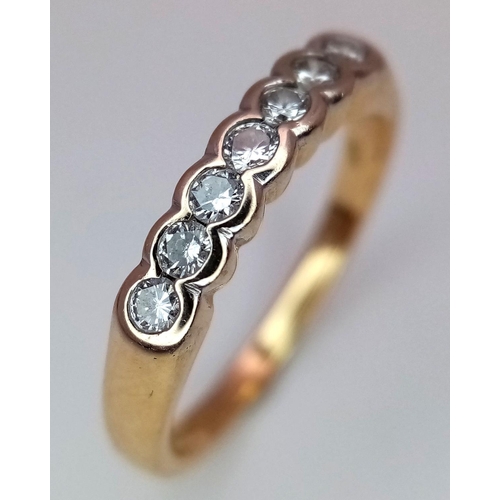 250 - A 18K YELLOW GOLD 7 STONE DIAMOND RING. 0.20CT. 2.6G IN WEIGHT. SIZE I AND 1/2. Ref: SC 5037