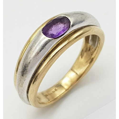 266 - Impressive and unusual 9 carat YELLOW and WHITE GOLD RING, Having an oval AMETHYSYT channel set to t... 