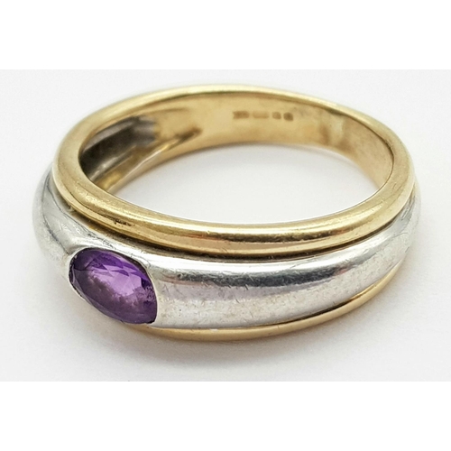 266 - Impressive and unusual 9 carat YELLOW and WHITE GOLD RING, Having an oval AMETHYSYT channel set to t... 