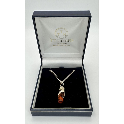 273 - Interesting and unusual AMBER and SILVER PENDANT Mounted on a fancy link SILVER CHAIN NECKLACE. Pres... 