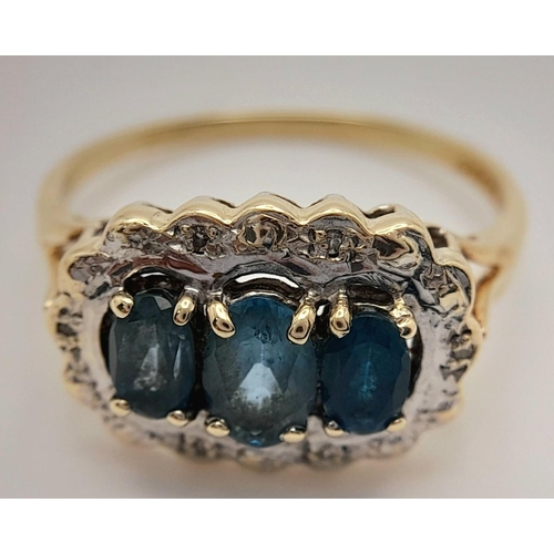 278 - A 9K YELLOW GOLD DIAMOND & TEAL SAPPHIRE RING. 2.9G IN WEIGHT. SIZE R. Ref: SC 5003.