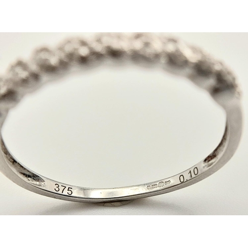 306 - A 9K WHITE GOLD DIAMOND BAND RING. 0.10CT. 1.3G TOTAL WEIGHT. SIZE P. Ref: SC 5010