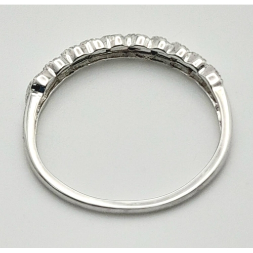 306 - A 9K WHITE GOLD DIAMOND BAND RING. 0.10CT. 1.3G TOTAL WEIGHT. SIZE P. Ref: SC 5010