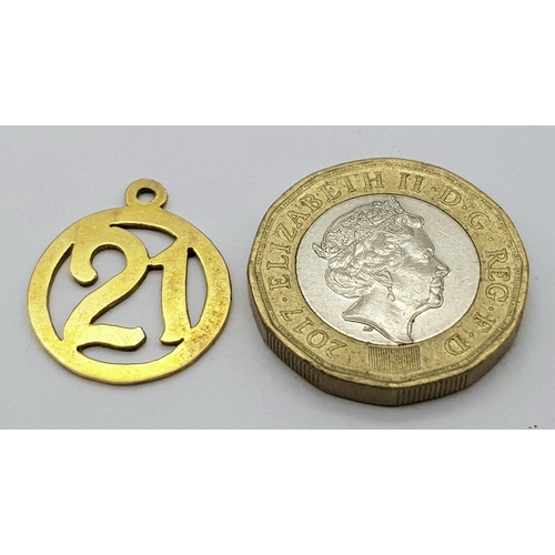 322 - Hallmarked 9 carat GOLD  ‘21’ CHARM. 1.2 grams approx.