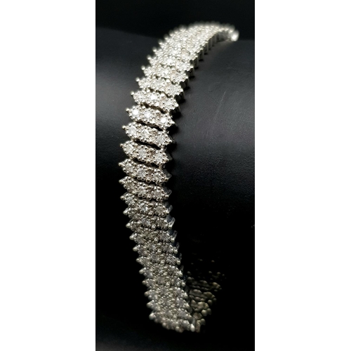 327 - A 9K WHITE GOLD DIAMOND SET BRACELET. 3CT. 24.8G IN WEIGHT. APPROX 18CM IN LENGTH.. Ref: SC 5071.