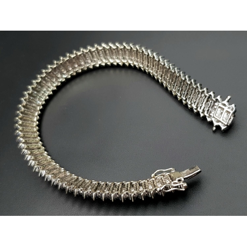 327 - A 9K WHITE GOLD DIAMOND SET BRACELET. 3CT. 24.8G IN WEIGHT. APPROX 18CM IN LENGTH.. Ref: SC 5071.