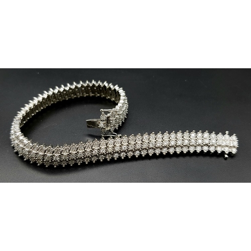 327 - A 9K WHITE GOLD DIAMOND SET BRACELET. 3CT. 24.8G IN WEIGHT. APPROX 18CM IN LENGTH.. Ref: SC 5071.