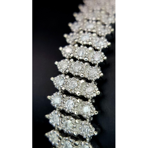 327 - A 9K WHITE GOLD DIAMOND SET BRACELET. 3CT. 24.8G IN WEIGHT. APPROX 18CM IN LENGTH.. Ref: SC 5071.