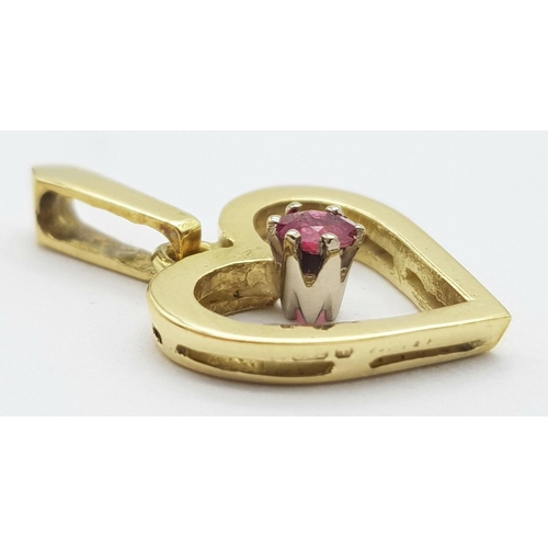 341 - A 18K YELLOW GOLD ( TESTED ) RUBY SET HEART PENDANT. 1.9G IN WEIGHT. 1.2CM IN LENGTH. Ref: SC 5080.