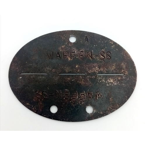 374 - An Original WW2 German Waffen SS Identity Disc. Clear Identification Stamps in Good Original Conditi... 