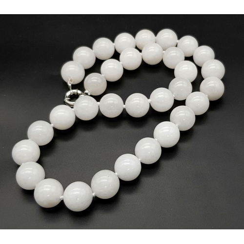 390 - A Chinese Large White Jade Bead Necklace. 14mm beads. 46cm necklace length.