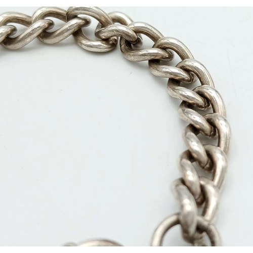 392 - Classic SILVER CHAIN LINK BRACELET. Complete with safety chain and heart padlock fastening. Fully ha... 