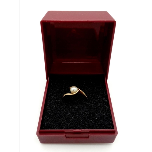 413 - Dainty 9 carat GOLD CROSSOVER RING with single pearl set to top. Fully hallmarked and complete with ... 