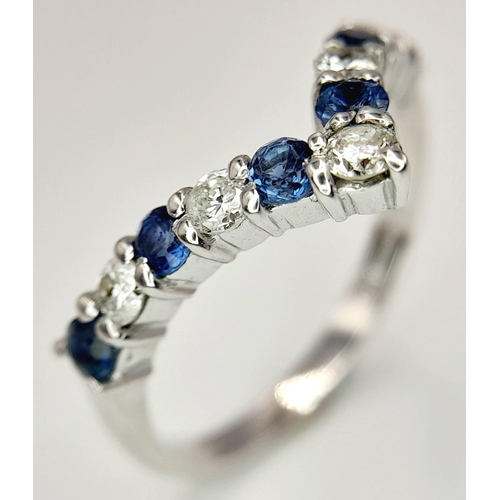 446 - A 18K WHITE GOLD DIAMOND & SAPPHIRE WISHBONE SHAPED BAND RING 0.25CT DIAMONDS & 0.30CT SAPPHIRES. 3.... 