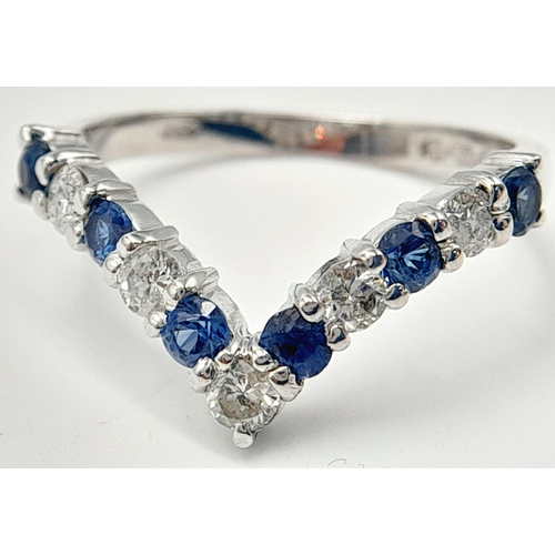 446 - A 18K WHITE GOLD DIAMOND & SAPPHIRE WISHBONE SHAPED BAND RING 0.25CT DIAMONDS & 0.30CT SAPPHIRES. 3.... 