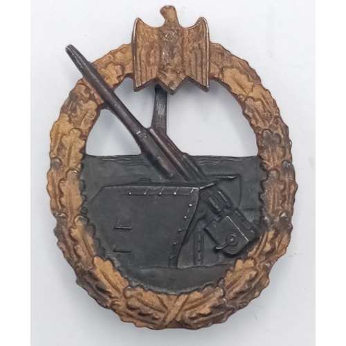 48 - WW2 German Kriegsmarine Coastal Artillery Badge. Maked “65” in a diamond shaped box for the Klein & ... 