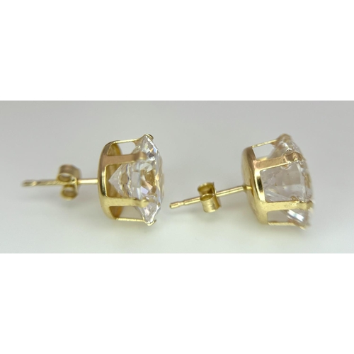 49 - Impressive 9 carat GOLD EARRINGS with COLOUR CATCHING CRYSTAL SEARCHLIGHT GEMSTONES. Complete with 9... 