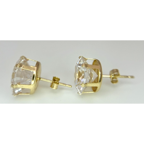 49 - Impressive 9 carat GOLD EARRINGS with COLOUR CATCHING CRYSTAL SEARCHLIGHT GEMSTONES. Complete with 9... 