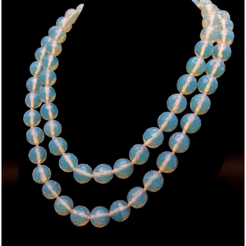 498 - A Romantic Matinee Length Moonstone Beaded Necklace. 90cm necklace length. 10mm faceted beads.