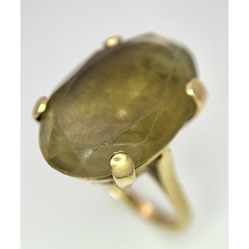 582 - A Vintage 9K Yellow Gold Smoky Quartz Ring. Large scrolled setting. Size N. 12.2g total weight.