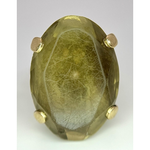 582 - A Vintage 9K Yellow Gold Smoky Quartz Ring. Large scrolled setting. Size N. 12.2g total weight.