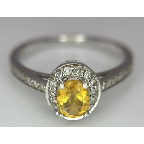 607 - A 9K WHITE GOLD DIAMOND & CITRINE CLUSTER RING - 0.13CT. 1.9G. SIZE J. REF: A/S 1070